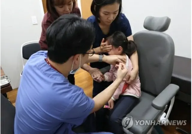 インフルエンザの予防接種を受ける子ども（資料写真）＝（聯合ニュース）