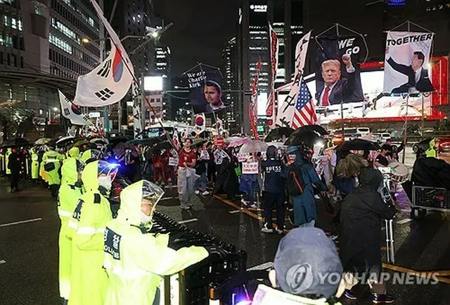 ソウルの繁華街・明洞での反中デモ＝（聯合ニュース）