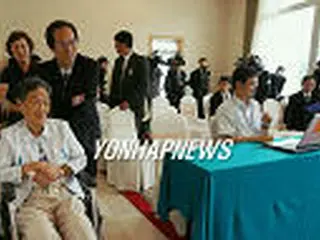 会見を行う金英男さん