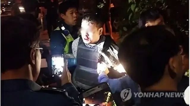 逮捕された容疑者（読者提供）＝１８日、ソウル（聯合ニュース）
