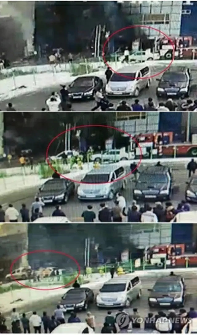 移動される車両（赤い丸）が写った防犯カメラの映像＝２２日、堤川（聯合ニュース）
