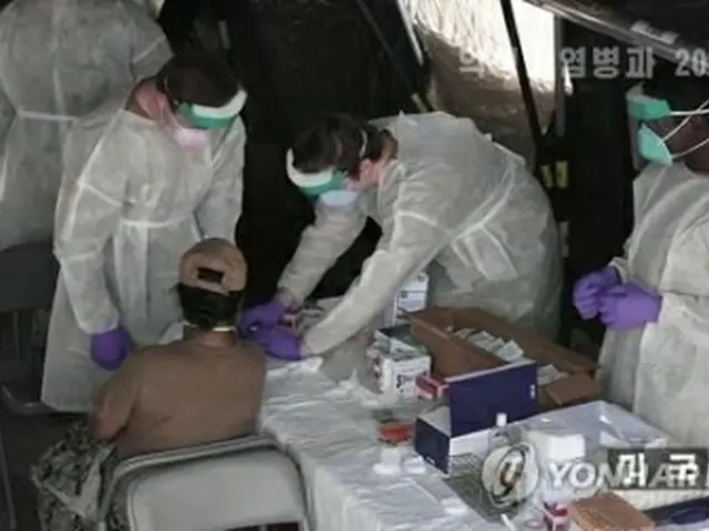 北朝鮮の朝鮮中央テレビが昨年１２月２５日に放送した新型コロナに関する特集番組（同テレビから）＝（聯合ニュース）≪転載・転用禁止≫
